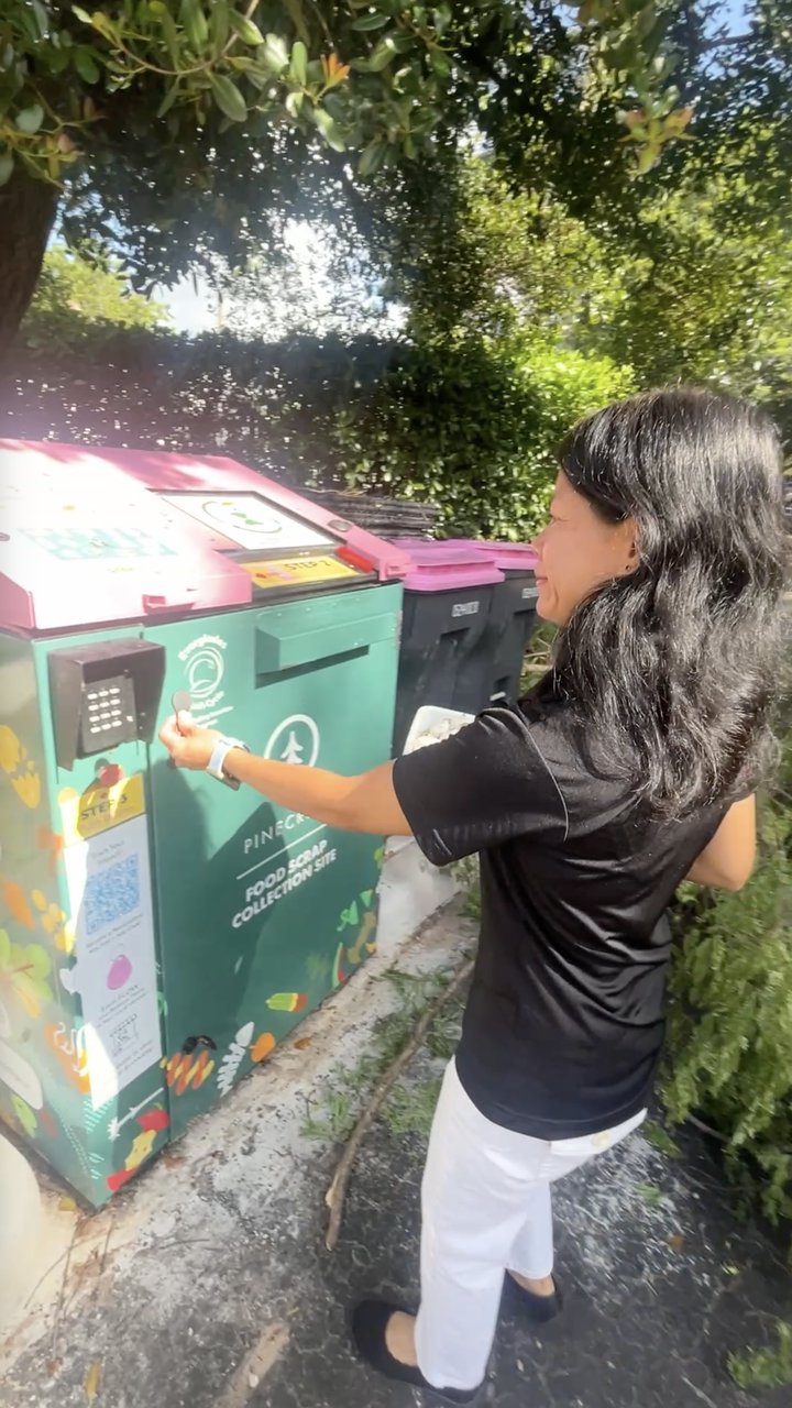 Dropping food scraps at a Community Food Scrap Drop-Off Site